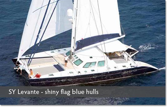 SY Levante - shiny flag blue hulls boat repair Phuket
